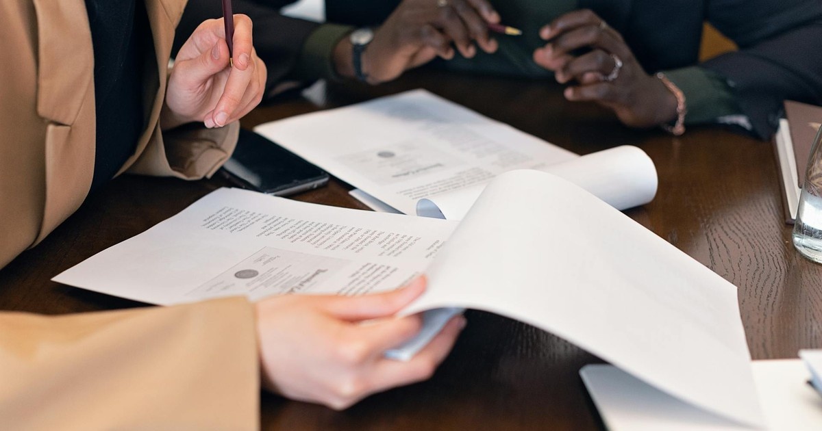 Person reviewing USCIS Form N-14 Request for Evidence after citizenship interview