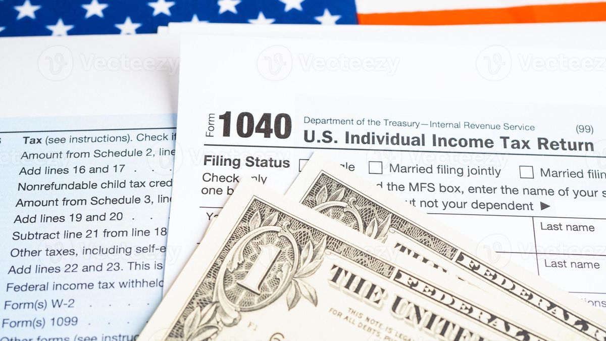 Tax documents and U.S. flag representing tax compliance for citizenship applicants